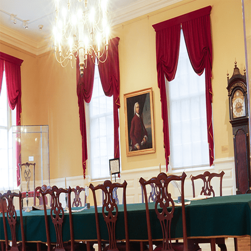 Council Chamber room within the Old State House, featuring a long table with elegant chairs.