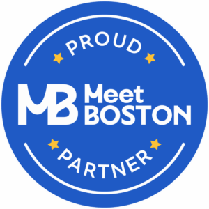 Blue circular logo of "Meet Boston" with "Proud Partner" text. No road to revolution reference.
