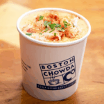A cup of clam chowder from Boston Chowda Co, suggesting a place to eat in Downtown Crossing.
